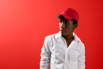 black man in red studio