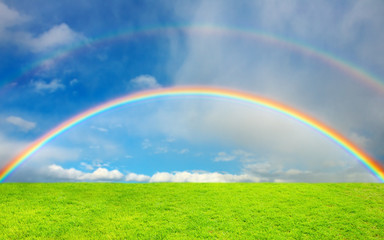 Rainbow over green field