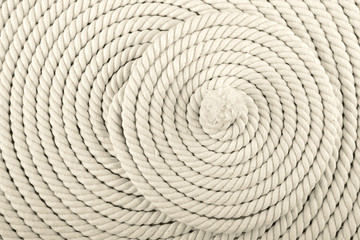 Heavy, white coiled rope.