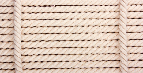 Heavy, white coiled rope.