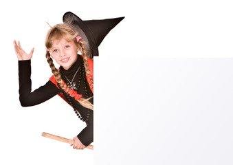 Child girl in Halloween witch costume with banner.