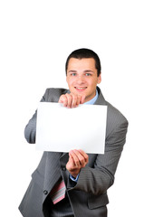 Young man holding a blank banner isolated on white