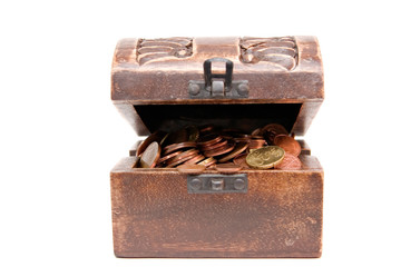 A wooden ancient chest full of money..