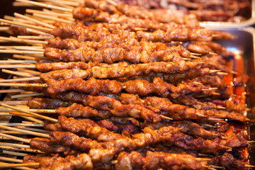 Roasted meat on wood sticks