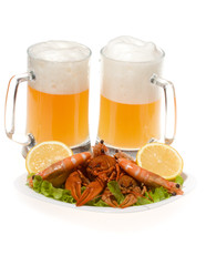 Mugs of beers with plate with shrimps and crayfishes