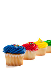 Assorted cupcakes on a white background