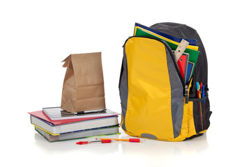 Yellow backpack with school supplies