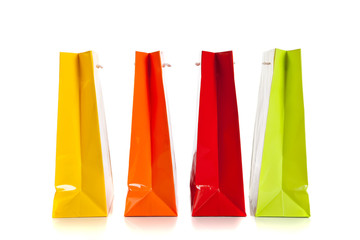 multi colored shopping bags on a white background
