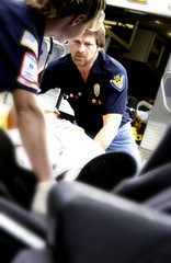 EMTs helping victim from car crash
