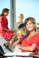 Businesswoman with apple