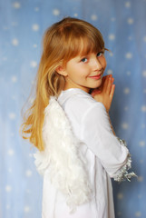 angel girl with hands  folded  to the prayer