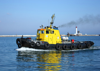 yellow tugboat