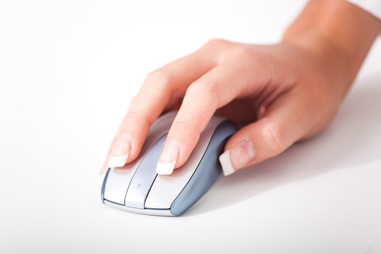 Womans hand and a computer mouse