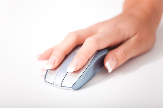 Womans hand and a computer mouse