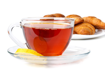 Fresh croissant and cup of tea