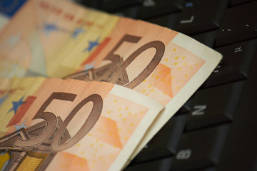 Euro note on laptop