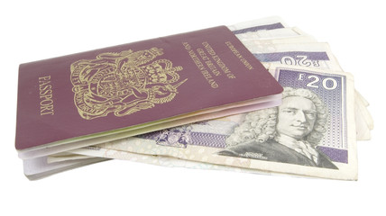 single british passport with cash isolated on white