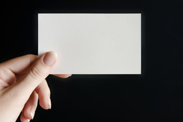 Paper card in hand