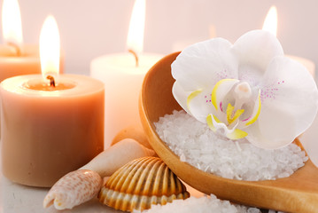 Fototapeta na wymiar Sea salt with orchid and candles