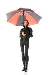 Woman dressed in black under red and black umbrella