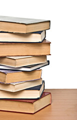 Pile of books  on desk