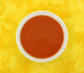 Tomato soup in white bowl