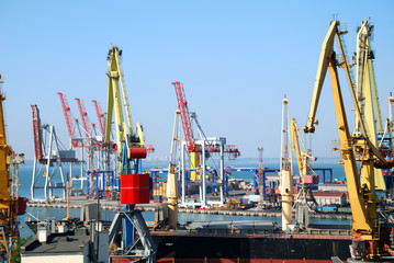 Fototapeta na wymiar The trading seaport with cranes, cargoes and ship