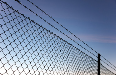 Chain link fence and barbed wire