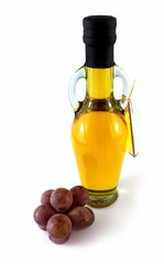 Oil bottle and the grapes