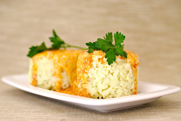 Rice with paprika chicken sauce and parsley on plate