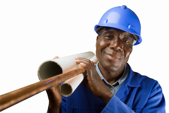 Senior South African Or American Plumber With Pipes