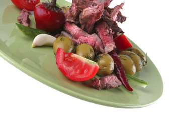 beef meat slices on green
