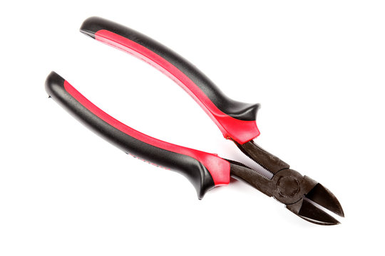 Red with black cutting pliers isolated on white background.