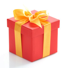 Single red gift box with gold ribbon on white background.