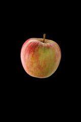 Red apple on black background