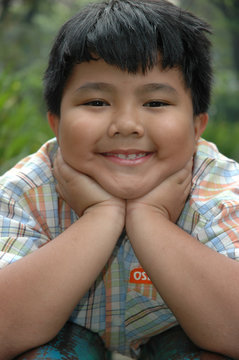 little boy get laying in the park
