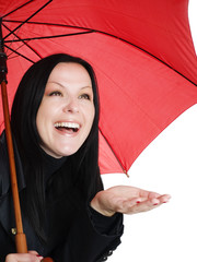 smiling brunette woman in fall clothes holding umbrella