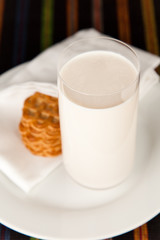 Fresh glass of milk and a few Cookies