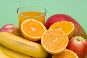 glass of fresh juice and fresh fruits