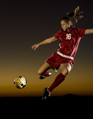 Female Soccer Player About to Kick the Ball
