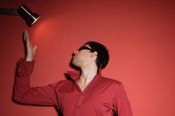 sexy young man on red background