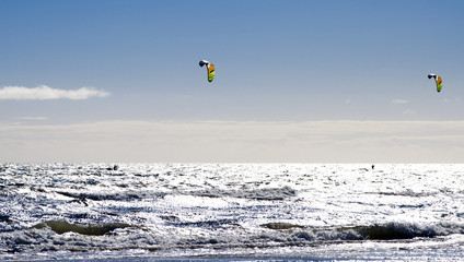 Two kite-surfers in action
