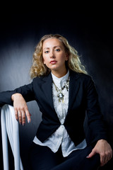 a young woman sitting on chair