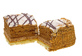 Two cakes with chocolate isolated on white