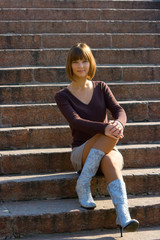 girl sitting at ladder steps