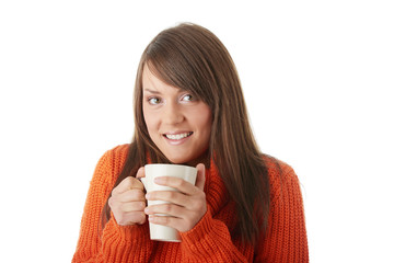 Teen woman with cup of coffee