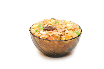 Transparent bowl with musli on white background