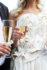groom and the bride with champagne glasses