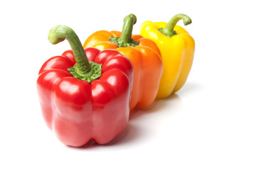 Red Yellow and Orange Bell Peppers on Isolated White
