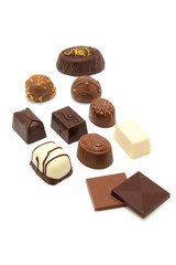 tasty chocolate bonbons over white background